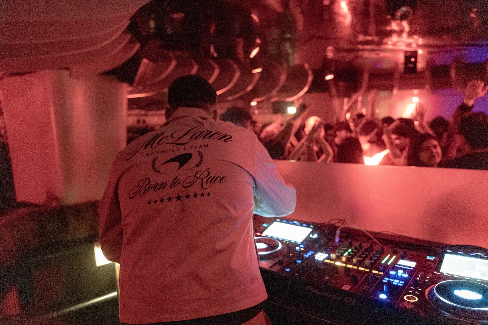 DJ performing at a vibrant nightclub event